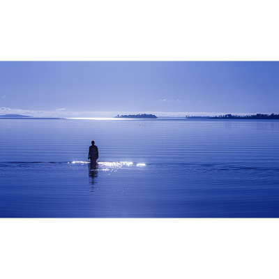 Woman Walking Into a Lake