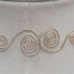Hand twisted clasp