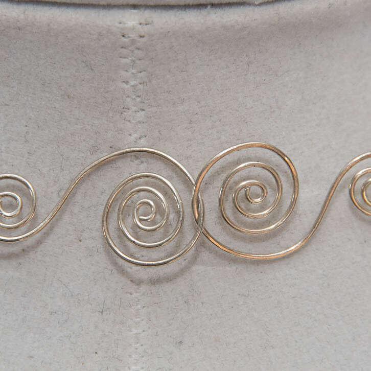 Hand twisted clasp